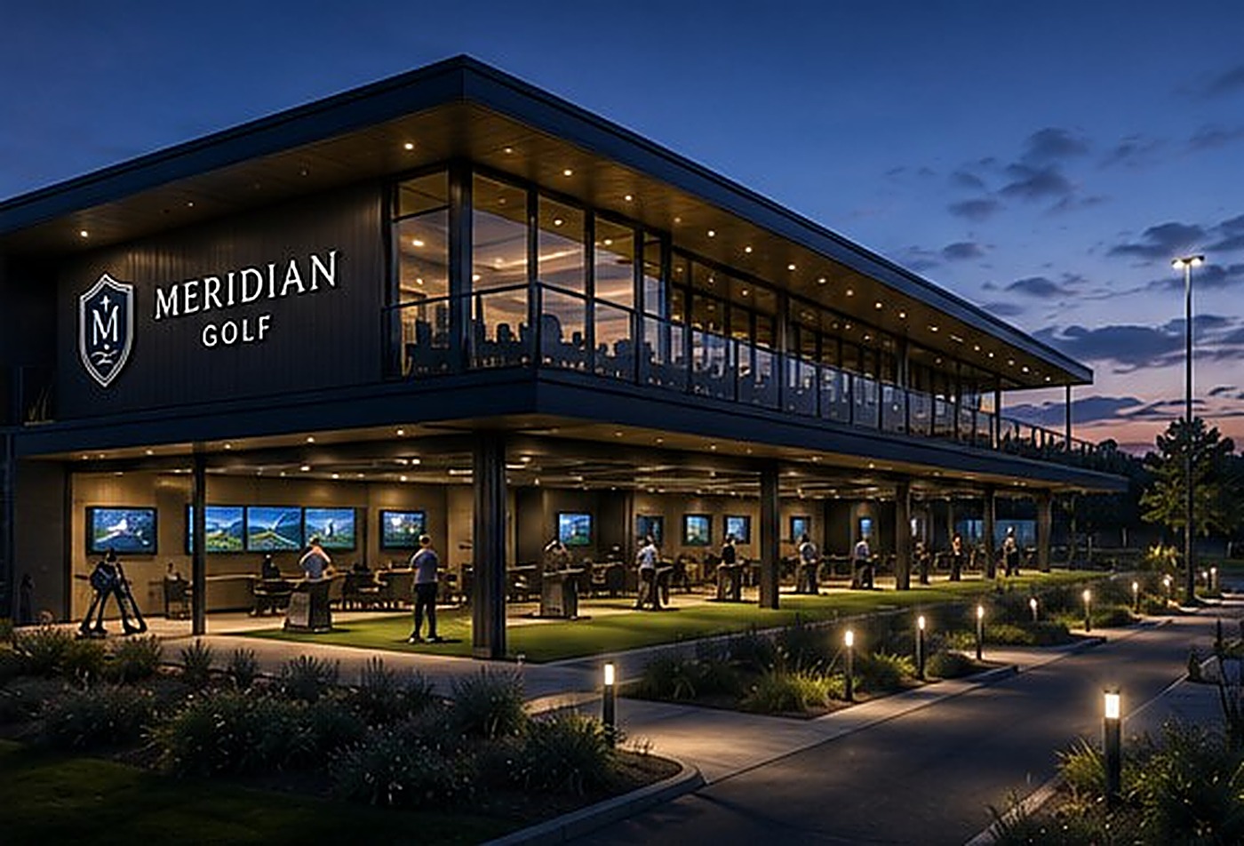 The Meridian Golf clubhouse and floodlit range at night